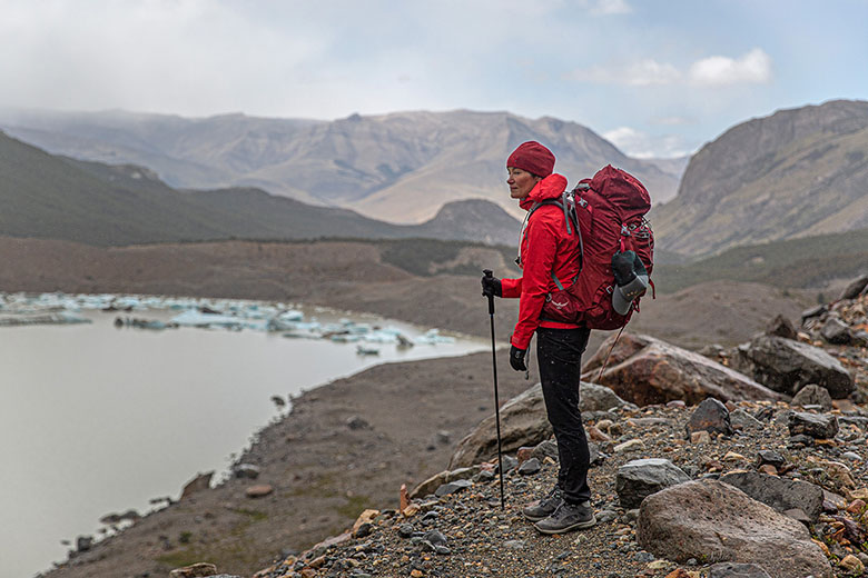 Osprey Ariel 65 backpacking pack (standing above icy lake)